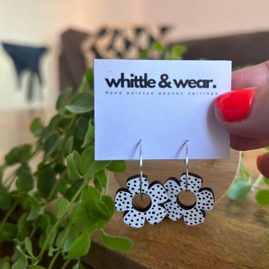 Round dangles. White with black spots
