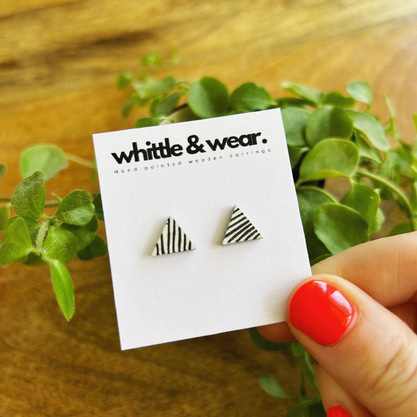 Triangular studs. White with black stripes