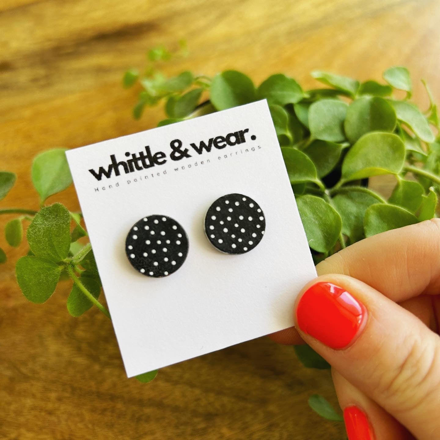 Round studs. Black with white spots