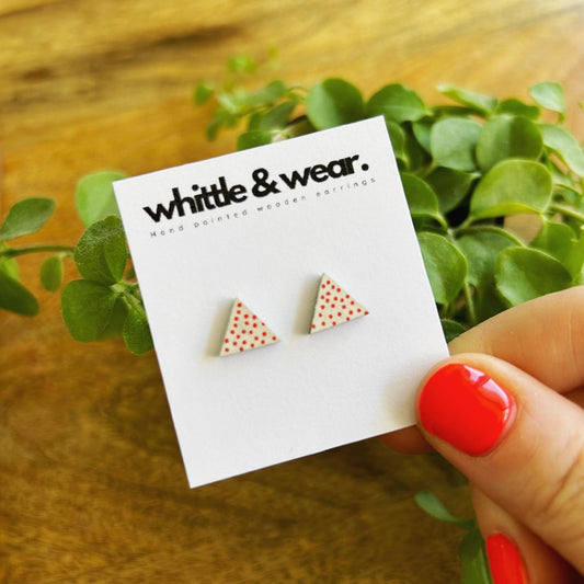 Triangular studs. White with red spots