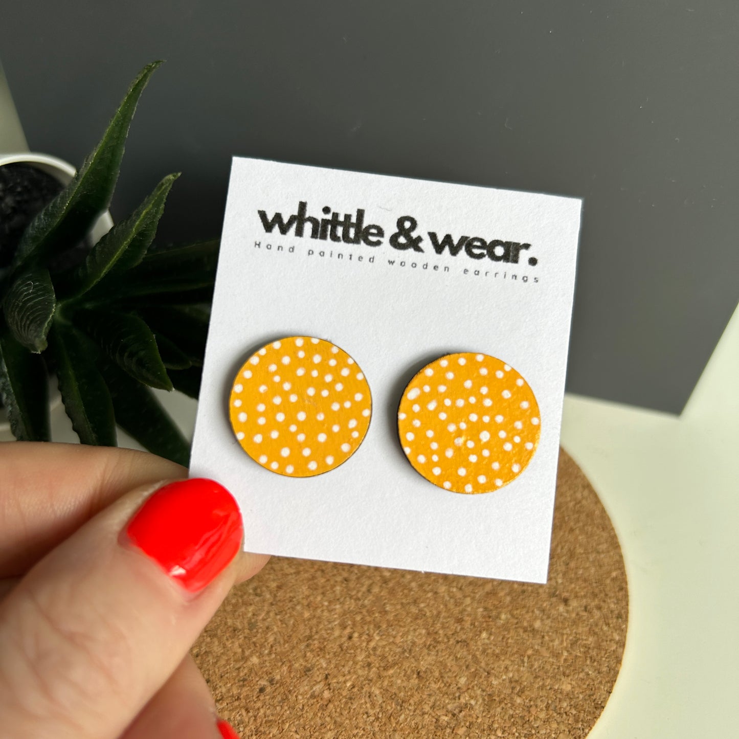 Round studs. Yellow with white spots