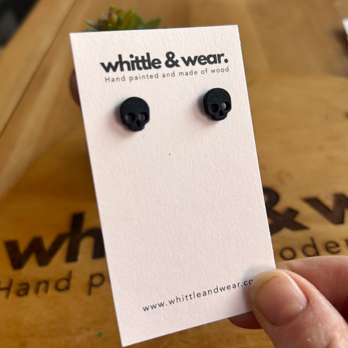 Black skull studs